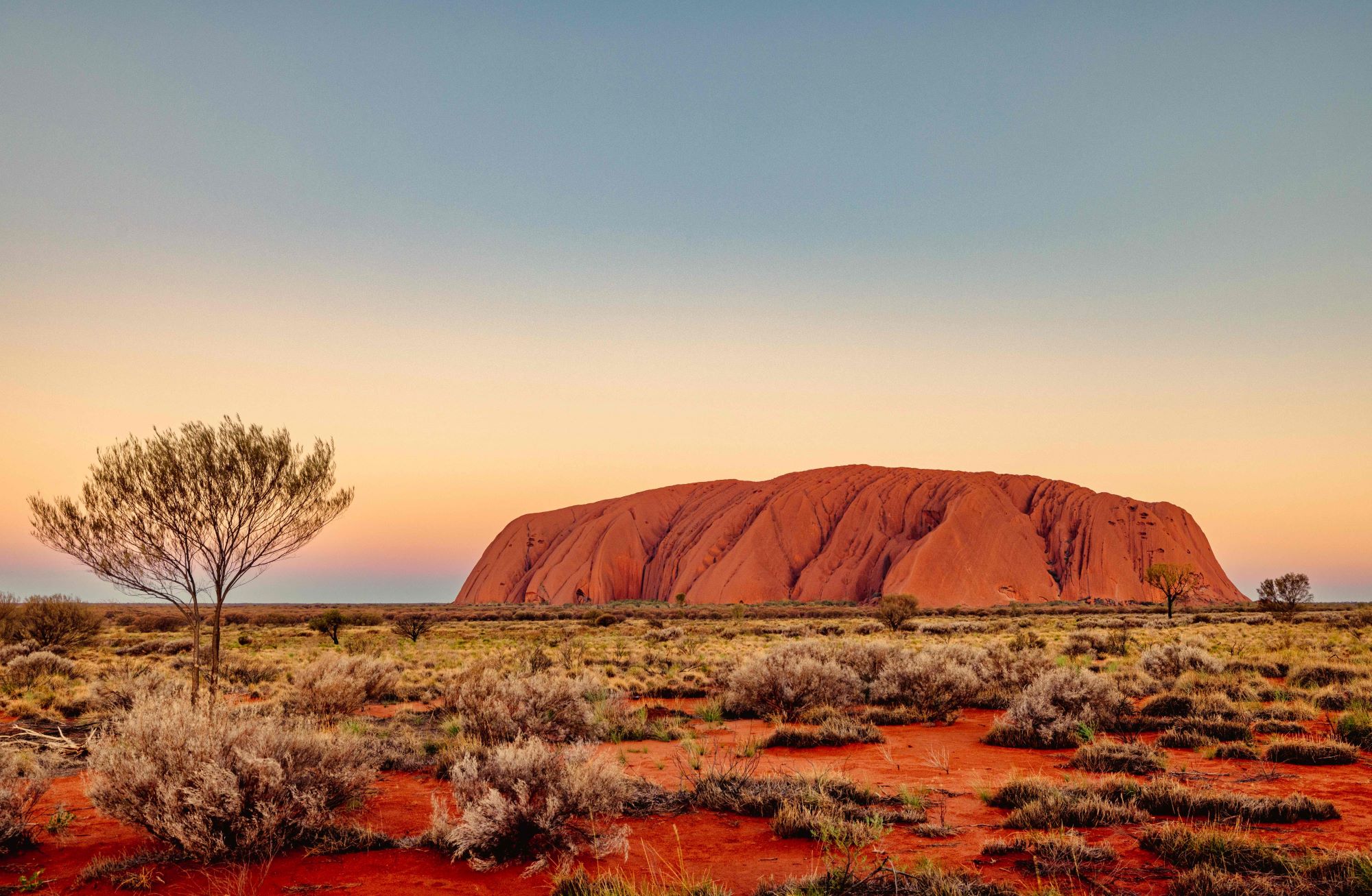 scenic-view-of-uluru-a-large-sandstone-formation-2023-12-28-18-57-34-utc (1)